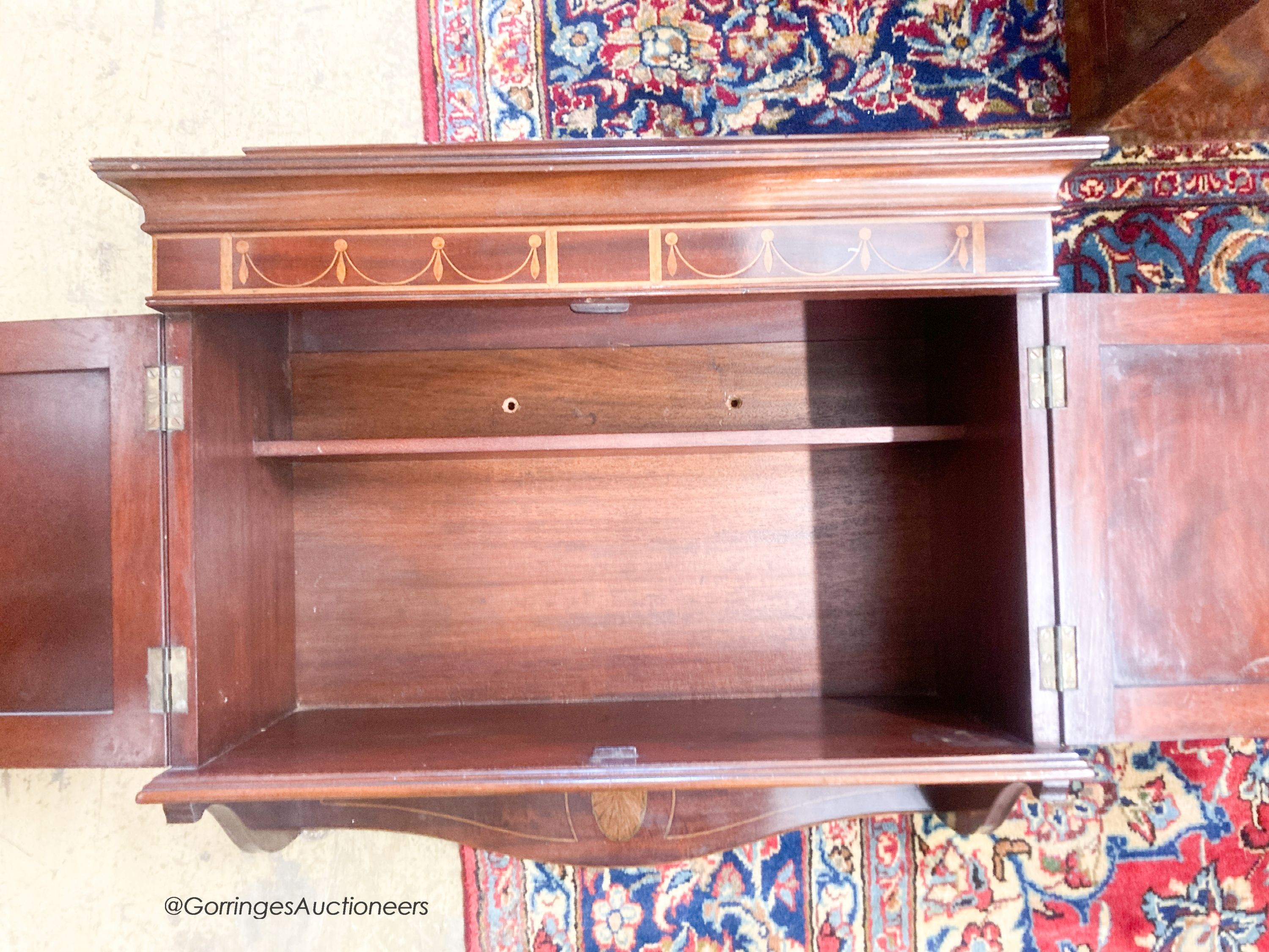 An Edwardian mahogany hanging two door wall cabinet, width 55cm, depth 24cm, height 54cm